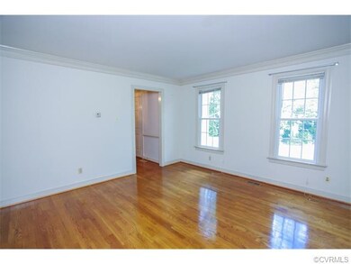 Living Room with hardwoods, crown molding