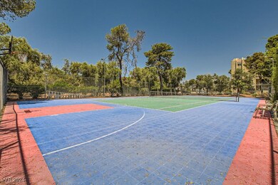 View of basketball court featuring a tennis court