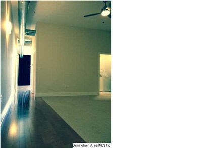 A view down the long unit hallway into the living 