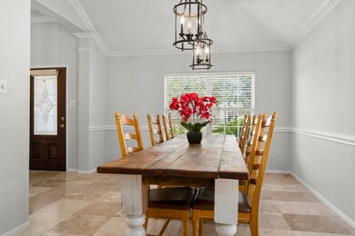 This dining area is huge. Two elegant chandeliers.