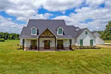 View of front of house featuring french doors, boa