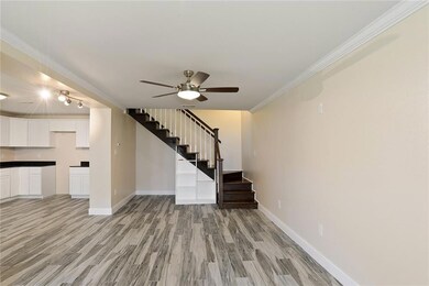 Large den w/ storage under staircase