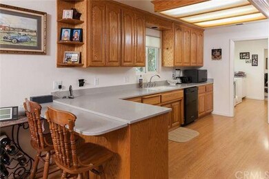 Side of spacious kitchen, corian countertops, cust