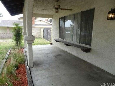 NICE BIG FRONT PORCH WITH CEILING FAN
