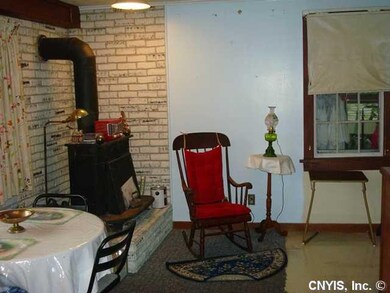 Kitchen. Woodstove for back up heat is in the larg