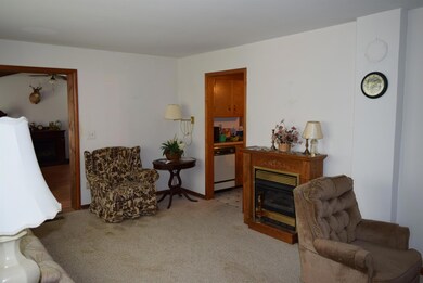 Another view of the formal living room.  Door to the left leads to large family room, and the door to the right goes to the kitchen.