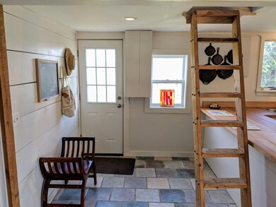 Kitchen mudroom with stairs up to...