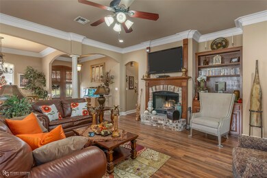 Living room featuring a fireplace, hardwood / wood