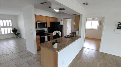 Kitchen with skylight and newer appliances.