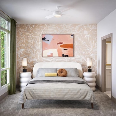 Bedroom featuring carpet flooring, connected bathroom, and ceiling fan