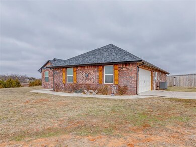 Ranch-style home with brick siding, a front lawn, 
