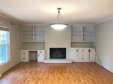 Bright & Open Living Room with Built in Shelving &