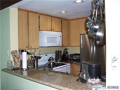 Kitchen with granite counters.
