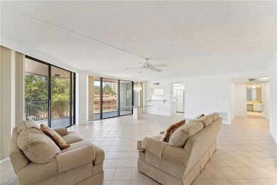 Living area featuring light tile patterned floorin