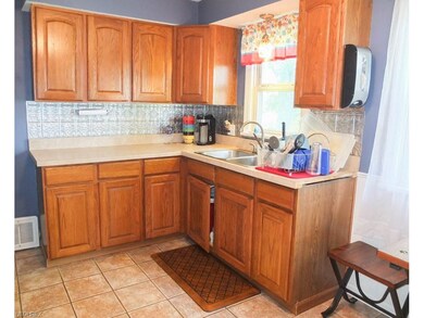 Kitchen has tile flooring.