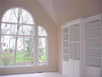 Great Room. BEAUTIFULL FULL WALL WINDOW OFFER NATURAL LIGHTING IN THE VAULTED CEILING GREAT ROOM. NOTE THE BUILT IN SHELVING , THE GAS FIREPLACE IS TO THE LEFT OF THE WINDOW IN BETWEEN THE GREAT ROOM AND FORMAL DINING AREA