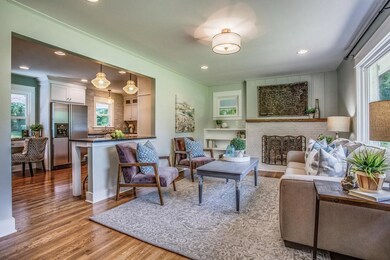 LIVING ROOM IS OPEN TO KITCHEN AND DINING AREA FOR THAT GREAT ROOM EFFECT