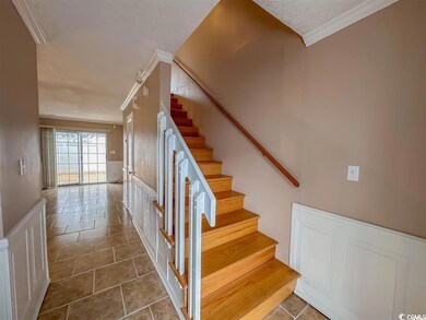 Stairway featuring tile patterned flooring, orname