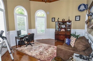 Fabulous office/library with tongue and groove ceiling and plantation shutters.