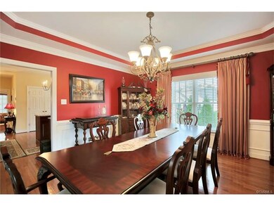 The dining room has custom moldings and a distingu
