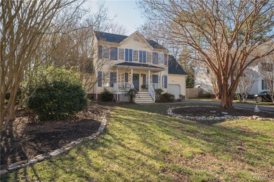View of front facade with aphalt driveway, a front