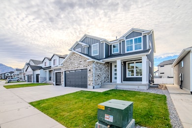 View of front of property featuring board and batten siding, stone siding, a residential view, concrete driveway, and a garage