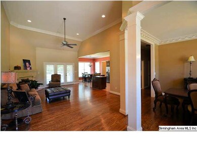 Open floor plan with gleaming hardwoods