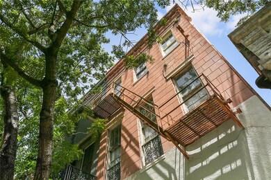 Lovely windows look into the tree canopy.