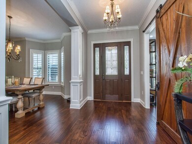 View of Front Entry with Dining Room and Office wi