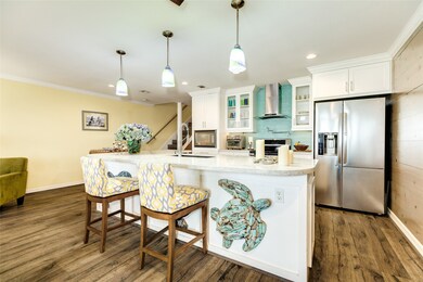 Island features a quartz counter top & single-basi