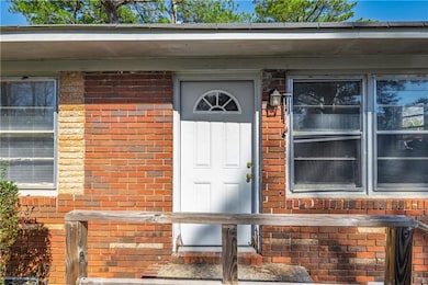 Property entrance with brick siding