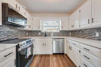 Kitchen featuring appliances with stainless steel 
