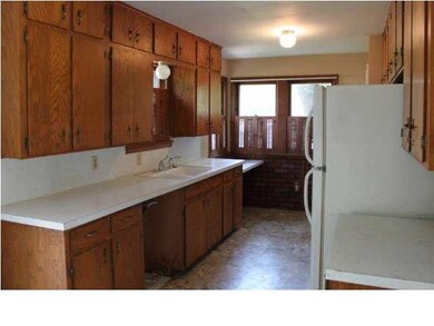 Kitchen is 13.5 x 8.6 with vinyl flooring.