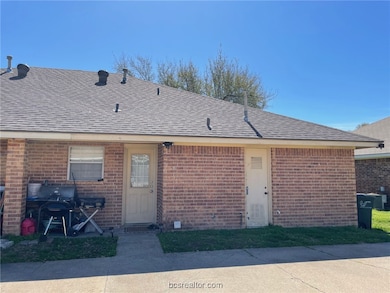 View of front of property featuring brick siding a