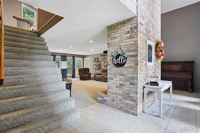 Stairs with tile patterned floors, carpet flooring, and recessed lighting