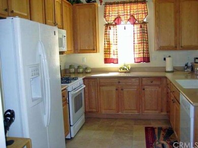 Corian counters and window sills make clean up a breeze.  You can easily enjoy the company of friends with the open kitchen.