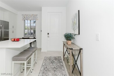 Entrance foyer featuring light tile patterned flooring