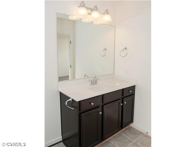 Bathroom - Photo is of similar home in community.
