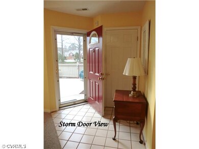 Foyer - Storm door -- hall closet and tile front e
