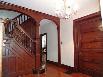 Entry/Foyer. Beautiful woodwork envelopes this gra