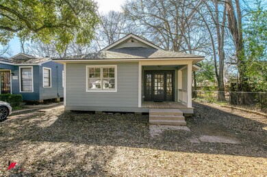 Bungalow-style house with french doors