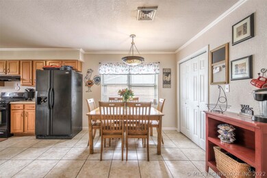 Pretty dining/kitchen area, door to the right is t