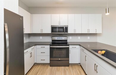 Modern kitchen with stainless steel appliances and