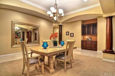 Formal dining room, crown molding, custom wine rac