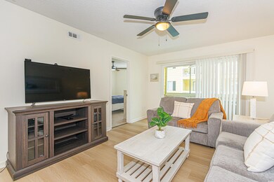 Living room featuring light hardwood / wood-style 
