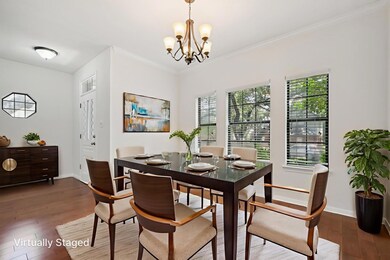 Dining area with a chandelier, wood-type flooring