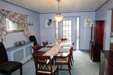 Formal Dining Room exits to 21 x 20 open porch ove