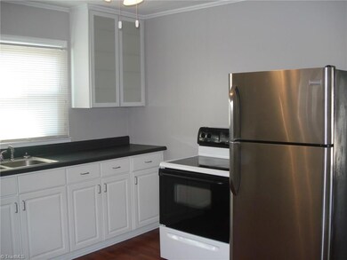 Bright Kitchen.  Refrigerator remains.