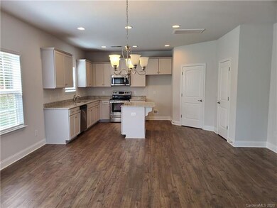 Dining area and kitchen ~ photo representation