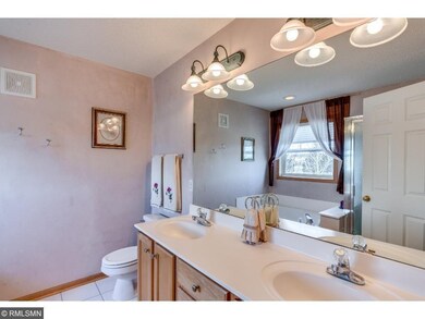 Master Bathroom with window and large vanity